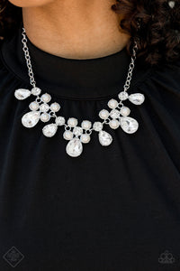 A sparkling collection of classic round and dramatic teardrop-shaped rhinestones fan out along the collar in a dazzling display. Timeless white pearls are sprinkled along the clusters of rhinestones, adding a beautiful refinement to the design. Features an adjustable clasp closure.