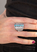 Load image into Gallery viewer, A row of dainty turquoise stones are stacked vertically down the center of a hammered silver frame for a seasonal flair. Features a stretchy band for a flexible fit.