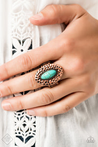 A refreshing turquoise stone is pressed into the center of a round copper frame hammered in antiqued shimmer for a handcrafted finish. Features a stretchy band for a flexible fit.
