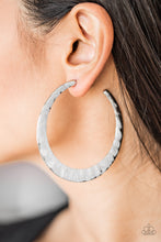 Load image into Gallery viewer, Brushed in a high-sheen finish, a delicately hammered silver hoop curls around the ear for a fierce look. Earring attaches to a standard post fitting. Hoop measures 2 1/2&quot; in diameter.  Sold as one pair of hoop earrings.  Always nickel and lead free.