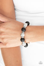 Load image into Gallery viewer, A collection of white rhinestone encrusted rings, shiny black beads, and classic silver beads are threaded along a stretchy band around the wrist for a glamorous look.  Sold as one individual bracelet. Always nickel and lead free.