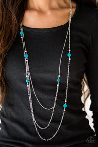 Brushed in a shell-like shimmer, iridescent blue beads and dainty silver beads trickle along glistening silver chains for a seasonal look.  Sold as one individual necklace. Includes one pair of matching earrings.  Always nickel and lead free.