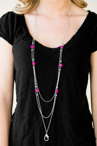 Brushed in a shell-like shimmer, iridescent pink beads and dainty silver beads trickle along glistening silver chains for a seasonal look. A lobster clasp hangs from the bottom of the design to allow a name badge or other item to be attached. Features an adjustable clasp closure.  Sold as one individual lanyard. Includes one pair of matching earrings. 