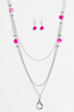Load image into Gallery viewer, Brushed in a shell-like shimmer, iridescent pink beads and dainty silver beads trickle along glistening silver chains for a seasonal look. A lobster clasp hangs from the bottom of the design to allow a name badge or other item to be attached. Features an adjustable clasp closure.  Sold as one individual lanyard. Includes one pair of matching earrings.
