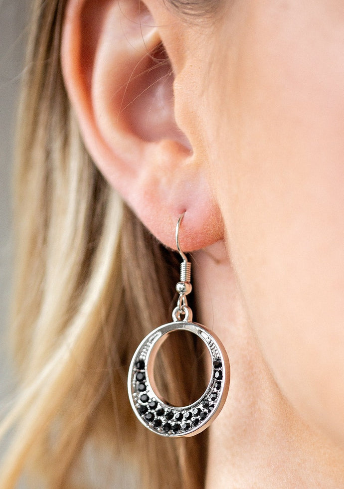 As if dipped in glitter, the bottom of a rounded silver hoop is encrusted in sparkling black rhinestones for a sparkling sophistication. Earring attaches to a standard fishhook fitting.  Sold as one pair of earrings.  