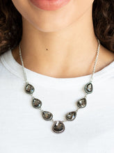 Load image into Gallery viewer, Featuring ornate silver frames, smoky teardrop gems link below the collar in a timeless fashion. The largest teardrop swings from the center, creating a glamorous pendant. Features an adjustable clasp closure.  Sold as one individual necklace. Includes one pair of matching earrings.