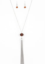 Load image into Gallery viewer, A glittery brown crystal-like bead swings from the bottom of a lengthened silver chain, giving way to a shimmering silver tassel for a glamorous finish. Features an adjustable clasp closure.  Sold as one individual necklace. Includes one pair of matching earrings.  Always nickel and lead free.