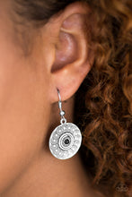 Load image into Gallery viewer,   Stamped in spiraling patterns, an antiqued silver frame swings from the ear in a dizzying fashion. A dainty black bead is pressed into the center of the frame, adding a colorful finish to the tribal inspired palette. Earring attaches to a standard fishhook fitting.  Sold as one pair of earrings. Always nickel and lead free.