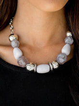 Load image into Gallery viewer, Necklace:  Dramatic silver, neutral gray, and faceted cloudy beads are threaded along an invisible wire below the collar for a seasonal look. Features an adjustable clasp closure.  Bracelet: Dramatic silver, neutral gray, and faceted cloudy beads are threaded along a stretchy elastic band, creating a seasonal look around the wrist.  Sold as one individual necklace, set of earrings, and bracelet.