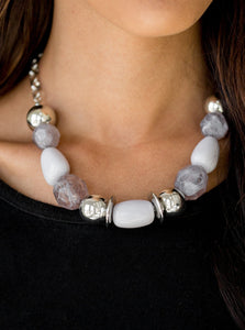 Necklace:  Dramatic silver, neutral gray, and faceted cloudy beads are threaded along an invisible wire below the collar for a seasonal look. Features an adjustable clasp closure.  Bracelet: Dramatic silver, neutral gray, and faceted cloudy beads are threaded along a stretchy elastic band, creating a seasonal look around the wrist.  Sold as one individual necklace, set of earrings, and bracelet.