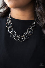 Load image into Gallery viewer, Gradually increasing in size, pairs of silver rings connect into bold stationary frames as they link below the collar for a dizzying look. Features an adjustable clasp closure.  Sold as one individual necklace. Includes one pair of matching earrings.   Always nickel and lead free.