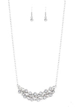 Load image into Gallery viewer, A collection of round and teardrop white rhinestones coalesce into a bowing silver pendant below the collar for a refined look. Features an adjustable clasp closure.  Sold as one individual necklace. Includes one pair of matching earrings.