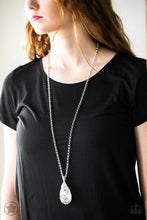 Load image into Gallery viewer, Infused with an elegantly elongated silver chain, a dramatic teardrop gem swings from the bottom of a white rhinestone encrusted silver fitting, creating a hypnotic pendant. Features an adjustable clasp closure.  Sold as one individual necklace. Includes one pair of matching earrings.  Always nickel and lead free.