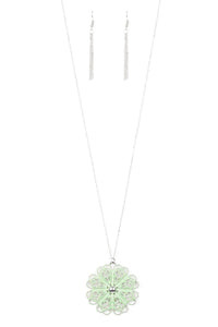  Brushed in a flirty green finish, a filigree filled pendant swings from the bottom of a lengthened silver chain for a seasonal look. Features an adjustable clasp closure.  Sold as one individual necklace. Includes one pair of matching earrings.