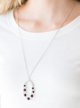 Load image into Gallery viewer, Varying in size, an array of glittery white and purple rhinestones are encrusted along a shimmery silver hoop. The sparkling pendant swings from the bottom of an elongated silver chain for a glamorous finish. Features an adjustable clasp closure.  Sold as one individual necklace. Includes one pair of matching earrings.