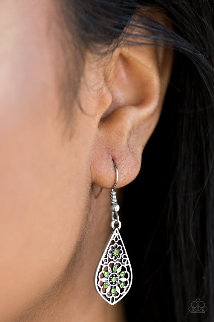 Glittery green rhinestones are sprinkled across a dainty floral frame, creating a whimsical lure. Earring attaches to a standard fishhook fitting.  Sold as one pair of earrings.   Always nickel and lead free.