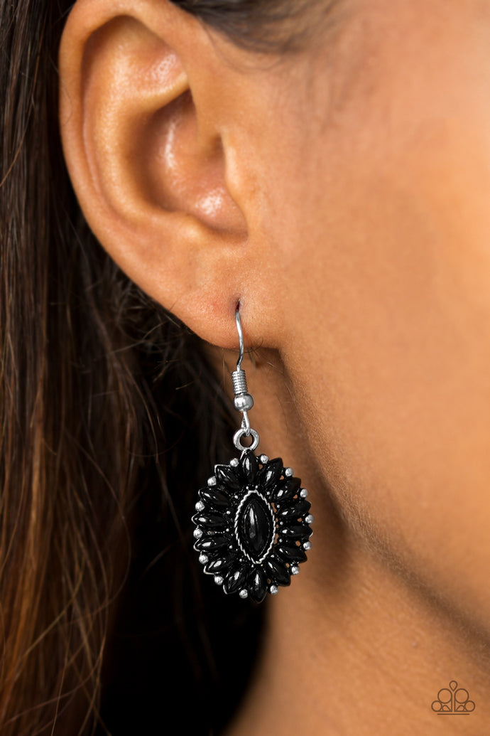 Marquise shaped black beads are pressed into a shimmery silver frame, coalescing into a whimsical lure. Earring attaches to a standard fishhook fitting.  Sold as one pair of earrings.  Always nickel and lead free.
