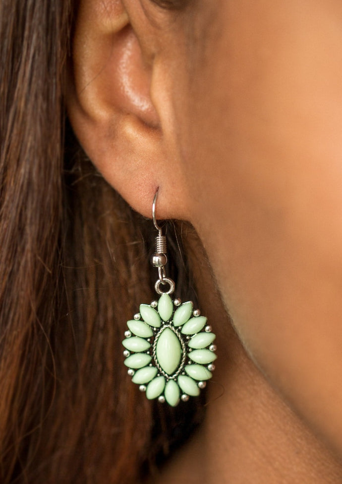 Green marquise shaped beads are pressed into a shimmery silver frame, coalescing into a whimsical lure. Earring attaches to a standard fishhook fitting.  Sold as one pair of earrings.
