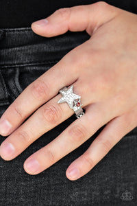 Dotted with a fiery red rhinestone, a dainty silver star joins a white rhinestone encrusted star atop a glistening silver band, creating a stellar centerpiece. Features a dainty stretchy band for a flexible fit.  Sold as one individual ring. 