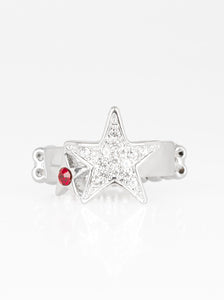 Dotted with a fiery red rhinestone, a dainty silver star joins a white rhinestone encrusted star atop a glistening silver band, creating a stellar centerpiece. Features a dainty stretchy band for a flexible fit. Sold as one individual ring.