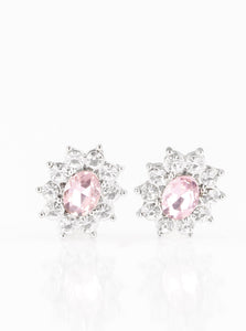 Glassy white rhinestones spin around an oval pink rhinestone center, coalescing into a refined frame. Earring attaches to a standard post fitting.  Sold as one pair of post earrings. 