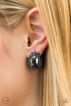 Load image into Gallery viewer, Two frames of glittery hematite rhinestones spin around a large glamorous hematite rhinestone, creating a stellar sparkle. Earring attaches to a standard clip-on fitting.  Sold as one pair of clip-on earrings.  Always nickel and lead free.