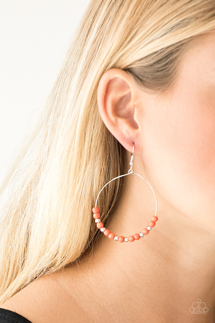 Dainty silver beads and refreshing orange stone beads slide along a dainty silver hoop for a seasonal look. Earring attaches to a standard fishhook fitting.  Sold as one pair of earrings.  Always nickel and lead free.