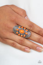 Load image into Gallery viewer, Embossed in a studded filigree pattern, an oval silver frame folds around the finger. Featuring round, oval, and teardrop shapes, vivacious orange stone beads are pressed into the center of the frame, creating a whimsical floral pattern. Features a stretchy band for flexible fit.  Sold as one individual ring.  Always nickel and lead free.