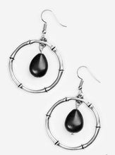 Load image into Gallery viewer, Chiseled into a tranquil teardrop, an earthy black stone swings from the top of a textured silver hoop, creating a handcrafted, artisan inspired lure. Earring attaches to a standard fishhook fitting.  Sold as one pair of earrings.