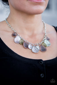 Delicately hammered in light-catching shimmer, copper, brass, and silver teardrops drip from the bottom of a glistening silver chain, creating a bold fringe below the collar. Features an adjustable clasp closure.  Sold as one individual necklace. Includes one pair of matching earrings.  Always nickel and lead free.