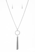 Load image into Gallery viewer, Encrusted in dazzling white rhinestones, a shimmery silver hoop swings from the bottom of an elegantly elongated silver chain for a refined look. A glistening silver tassel swings from the bottom of the glittery pendant for a flirty flair. Features an adjustable clasp closure.  Sold as one individual necklace. Includes one pair of matching earrings.  Always nickel and lead free.