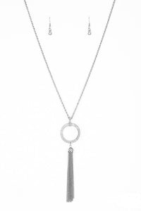 Encrusted in dazzling white rhinestones, a shimmery silver hoop swings from the bottom of an elegantly elongated silver chain for a refined look. A glistening silver tassel swings from the bottom of the glittery pendant for a flirty flair. Features an adjustable clasp closure.  Sold as one individual necklace. Includes one pair of matching earrings.  Always nickel and lead free.