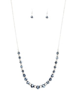 Load image into Gallery viewer, Varying in size, shiny silver beads, textured silver accents, and sparkling blue metallic crystal-like beads are threaded along an invisible wire at the bottom of a lengthened silver chain for a refined flair. Features an adjustable clasp closure.  Sold as one individual necklace. Includes one pair of matching earrings.