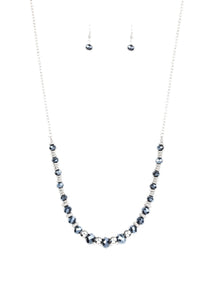 Varying in size, shiny silver beads, textured silver accents, and sparkling blue metallic crystal-like beads are threaded along an invisible wire at the bottom of a lengthened silver chain for a refined flair. Features an adjustable clasp closure.  Sold as one individual necklace. Includes one pair of matching earrings.