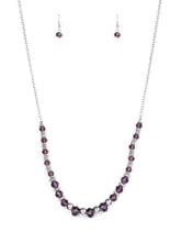 Load image into Gallery viewer, Varying in size, shiny silver beads, textured silver accents, and purple crystal-like beads are threaded along an invisible wire at the bottom of a lengthened silver chain for a refined flair. Features an adjustable clasp closure.  Sold as one individual necklace. Includes one pair of matching earrings.