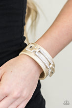 Load image into Gallery viewer, Encrusted in glittery white rhinestones, a glistening silver frame is studded in place across the front of a metallic gold band for an edgy look. Features an adjustable snap closure.  Sold as one individual bracelet.    Always nickel and lead free.