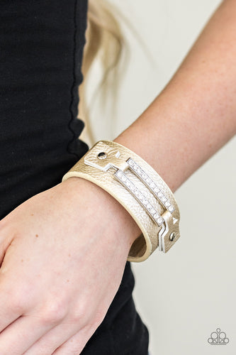 Encrusted in glittery white rhinestones, a glistening silver frame is studded in place across the front of a metallic gold band for an edgy look. Features an adjustable snap closure.  Sold as one individual bracelet.    Always nickel and lead free.