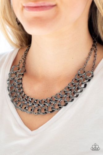 Asymmetrical gunmetal frames connect below the collar, creating a bold web-like fringe for a statement-making look. Features an adjustable clasp closure.  Sold as one individual necklace. Includes one pair of matching earrings.  Always nickel and lead free. 