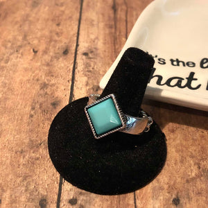Featuring a square shape, a faceted green bead sits atop an antiqued silver band for a seasonal look. Features a dainty stretchy band for a flexible fit.  Sold as one individual ring.  Always nickel and lead free.