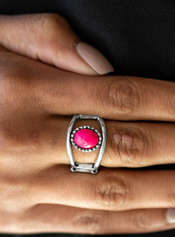 A vivacious pink bead is pressed into the center of an airy silver band for a summery look. Features an elastic stretchy band for a flexible fit.  Sold as one individual ring. 