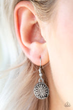 Load image into Gallery viewer, Embossed in a radiating daisy pattern, a dainty silver frame swings from the ear for a seasonal look. Earring attaches to a standard fishhook fitting.  Sold as one pair of earrings.  Always nickel and lead free.