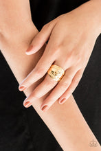 Load image into Gallery viewer, Ribbons of circular texture are embossed along the borders of a hammered gold band for an edgy look. Features a stretchy band for a flexible fit.  Sold as one individual ring.   Always nickel and lead free.