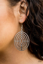 Load image into Gallery viewer, Oversized circular frames adorned in texture radiate from a central point, creating a dizzying design. Earring attaches to a standard fishhook fitting.  Sold as one pair of earrings.  Sunset Sightings Fashion Fix February 2020 Always nickel and lead free.