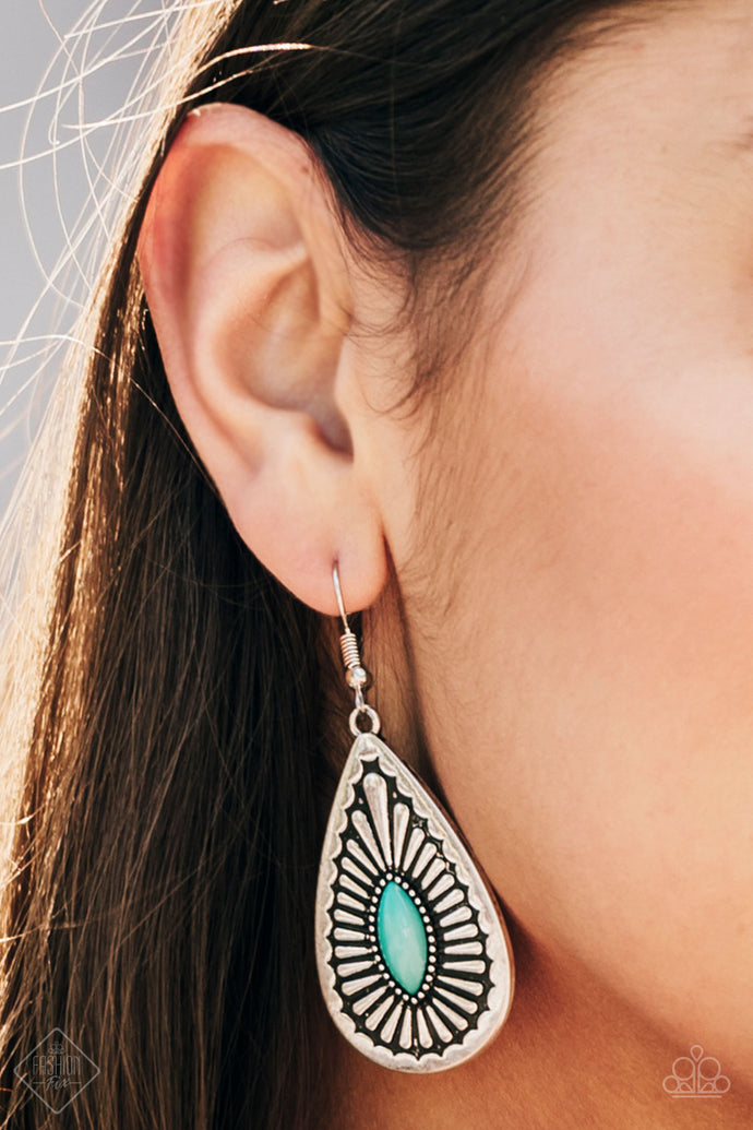 A shiny Arcadia bead is pressed into the center of a textured silver teardrop, creating a tribal inspired lure. Earring attaches to a standard fishhook fitting.