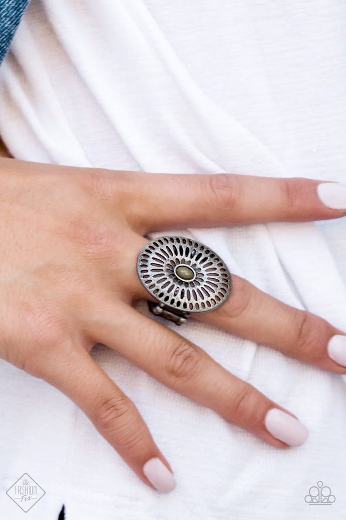 Brushed in a gritty antiqued silver matte, a grate-like frame spins around a Martini Olive beaded center for a rustic look. Features a stretchy band for a flexible fit.  Sold as one individual ring.      Sunset Sightings Fashion Fix October 2018   Always nickel and lead free.