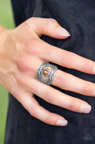 Swirling with filigree details, antiqued silver bars join around a robust Meerkat bead, creating a whimsical centerpiece atop the finger. Features a stretchy band for a flexible fit.  Sold as one individual ring.   Sunset Sightings Fashion Fix September 2018  Always nickel and lead free.