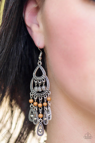 Dotted with brown beading, ornate silver teardrop frames swing from the bottom of a studded silver frame, creating a whimsical fringe. Earring attaches to a standard fishhook fitting.  Sold as one pair of earrings.   Sunset Sightings Fashion Fix September 2018   Always nickel and lead free.