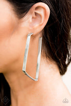 Load image into Gallery viewer, Brushed in an antiqued shimmer, a flat silver bar bends into an abstract geometric frame creating an edgy conversation starter. Earring attaches to a standard post fitting. Hoop measures approximately 1 1/2” in diameter.