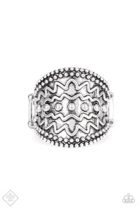 Studded and zigzagging textures are embossed across the front of a thick silver band for a tribal flair.