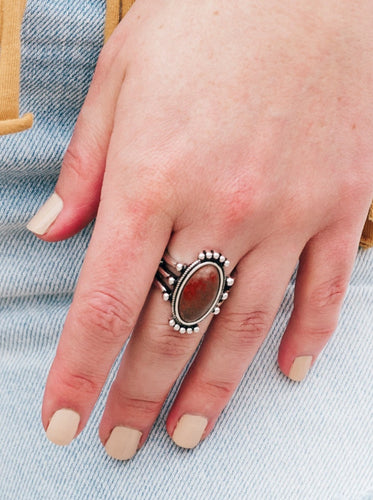 Chiseled into a tranquil oval, a smooth Chili Oil stone is pressed into a pronged frame for a seasonal look. Features a stretchy band for a flexible fit.  Sold as one individual ring.